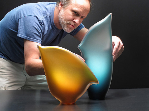 Bernard Katz adjusting Beach Horizon art glass sculpture